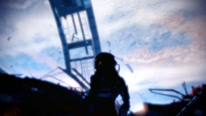 Commander Shepard gazes into space from the damaged Normandy in Mass Effect 2 