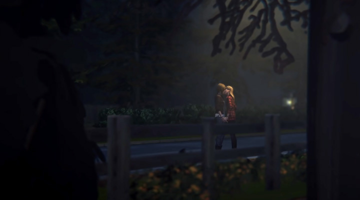 Two young girls kiss on a dark lane in Life is Strange: Before the Storm.